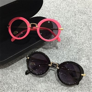 Roze en zwarte zonnebril met rond montuur voor kleine meisjes