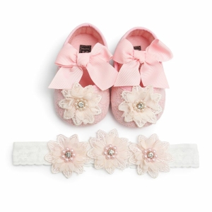 Modieuze roze en witte meisjes ballerina met strikje en bloem